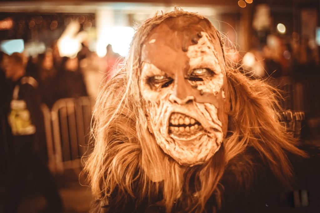 person-in-a-creepy-mask-with-fur-collar-and-hair-enjru-lb9ao