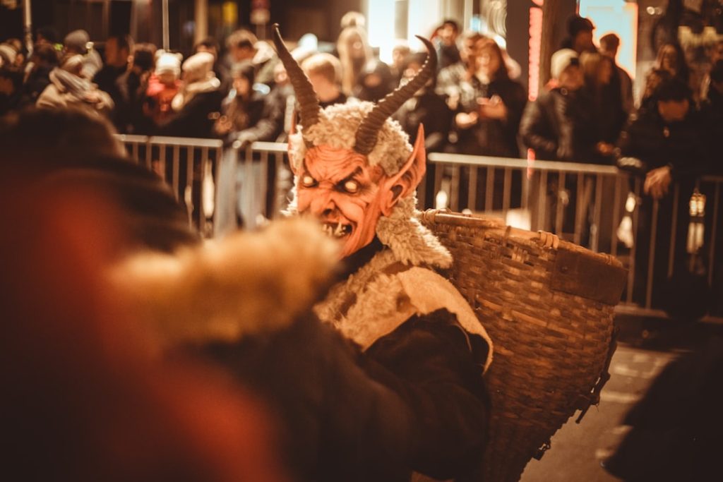 person-in-krampus-costume-with-horns-and-fur-diuevjb5neu